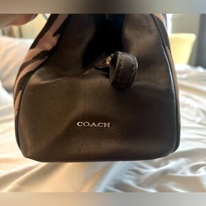 Med zebra print. Brown material w gold hardware. Triple compartment